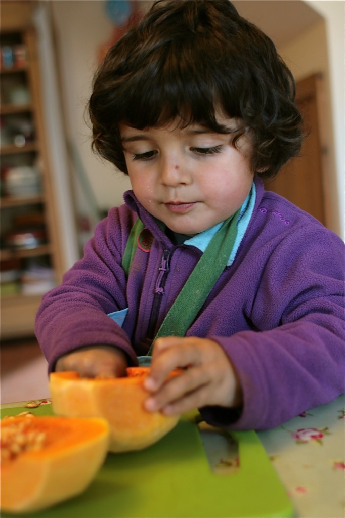 Jacques helpfully de-seeding a pumpkin for me!